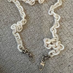 Kelly Wynne acrylic crossbody chains in ivory and pink